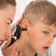 doctor checking kid's ear